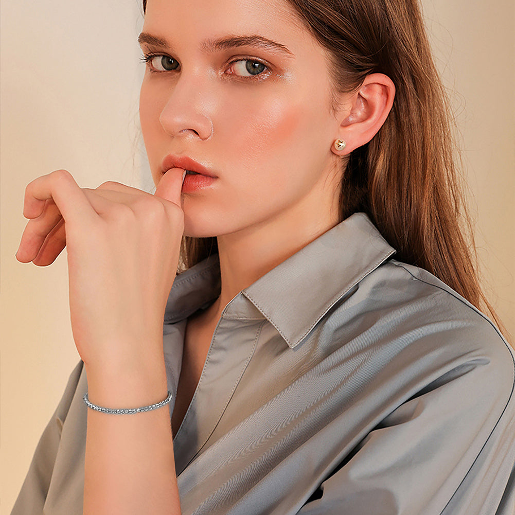 woman wearing a rhodium plated silver chain diamond bracelet 